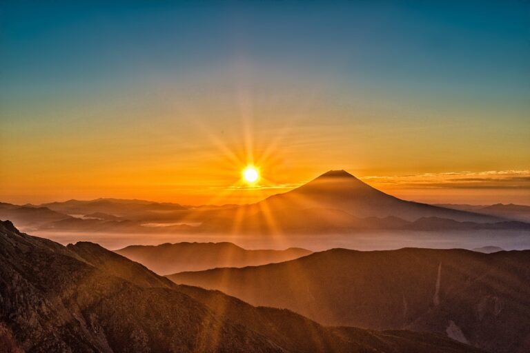 sunrise photo set against Mount Fuji. Misty morning in the mountains. Photo is by Image by Kanenori from Pixabay Link: https://pixabay.com/photos/mount-fuji-japan-volcano-mountain-2297961/