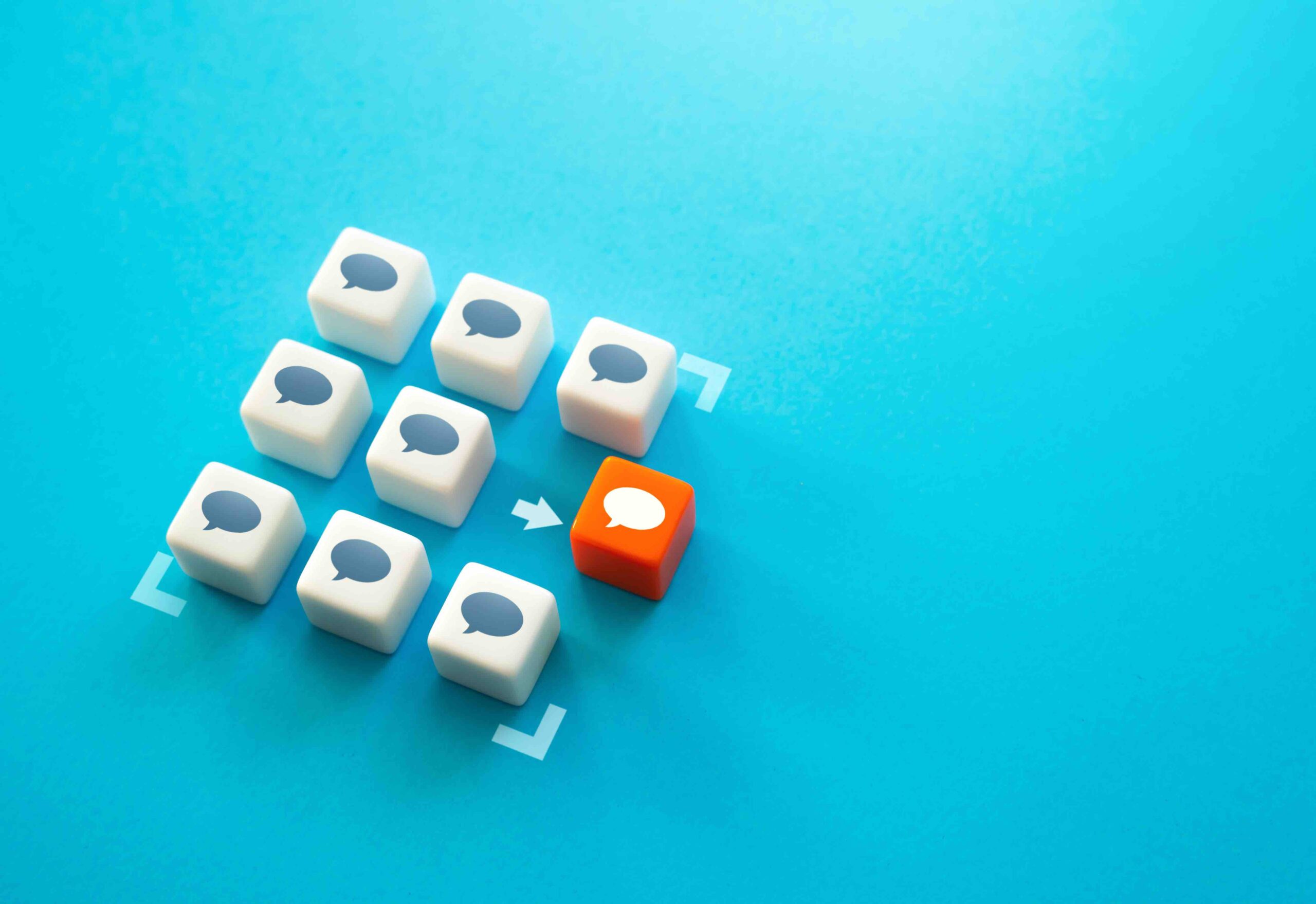 Chat bubble boxes in a square. One red chat bubble box stands out and moving outside the square.
