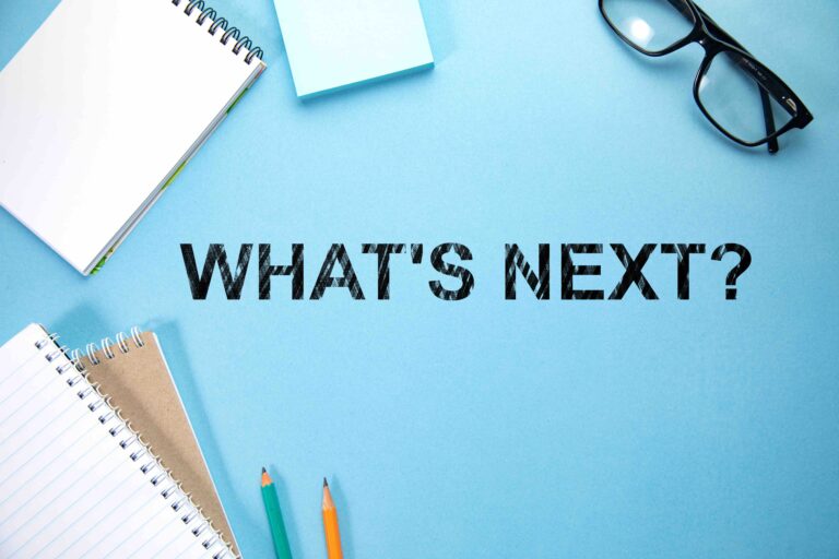 what's next text with notepads on working table