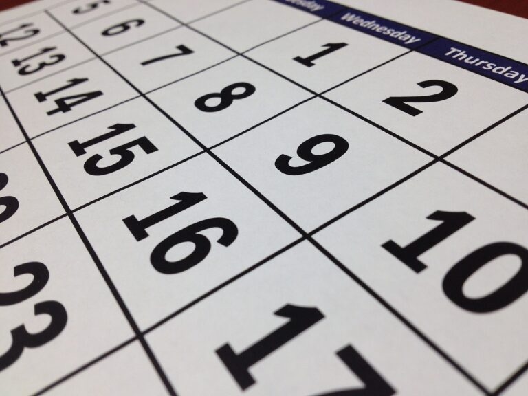 sideways angled photo of a calendar. White paper black numbers/dates. This image is by tigerlily713 from Pixabay